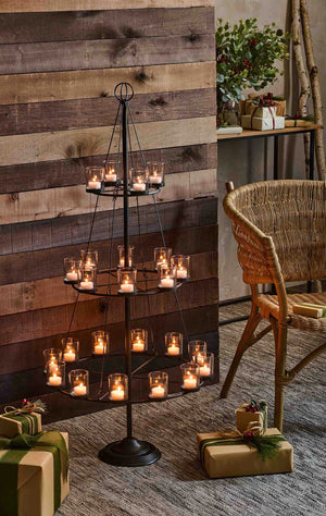 Votive tree carousel with candles lit.