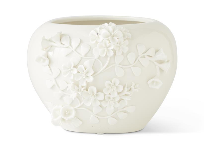 white ceramic pot with jasmine flowers
