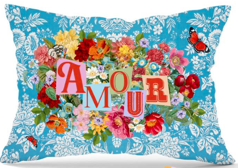 Decorative velvet throw pillow with florals and text "Amour".