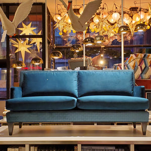 custom sofa in brilliant Peacock Teal velvet and quilted geometric pattern