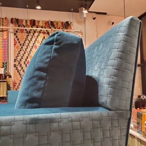close up of custom sofa in brilliant Peacock Teal velvet and quilted geometric pattern