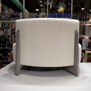 back of cream coloured curved sofa