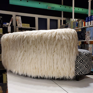 faux Mongolian fur sofa with striking geometrics