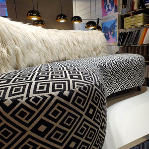 faux Mongolian fur sofa with striking geometrics