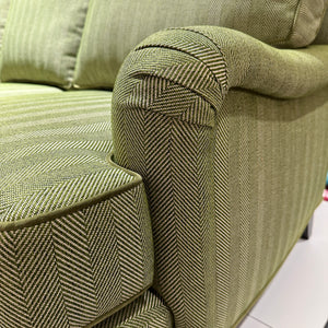 arm detail of green sofa