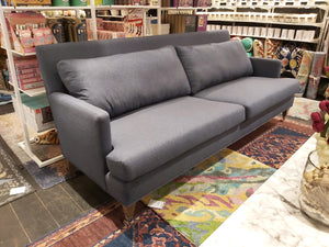 Grey upholstered sofa custom made in Canada.