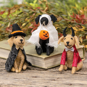 Felt dog ornaments in Halloween outfits.