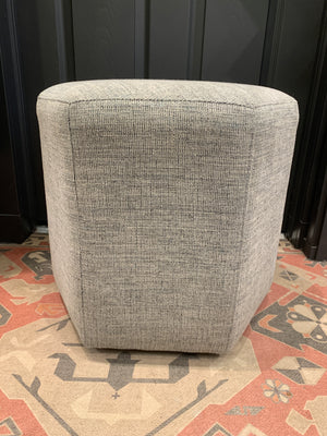 Grey hexagonal ottoman.