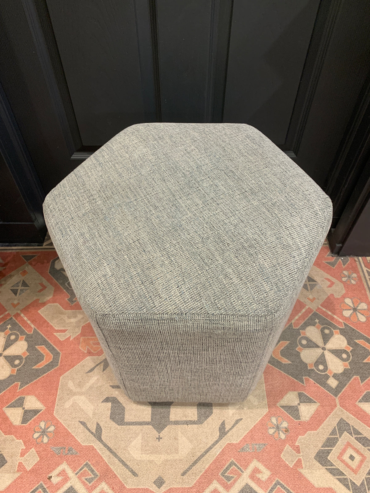 Grey hexagonal ottoman.