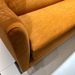 close-up of seat of orange sofa in stain resistant fabric