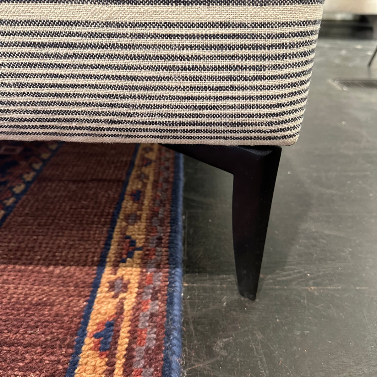 close up of black metal sofa legs