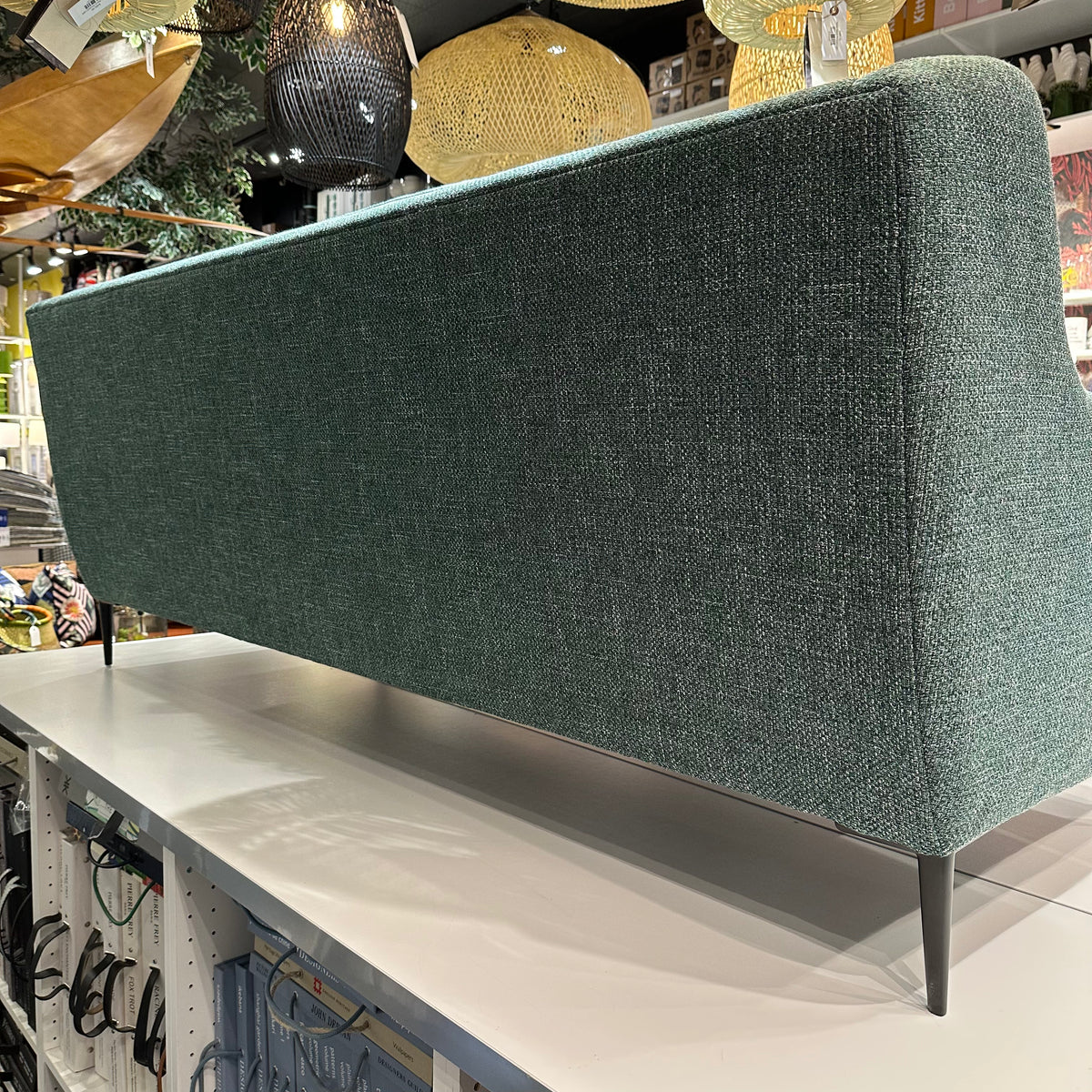 back view of custom green tweed sofa with black metal legs