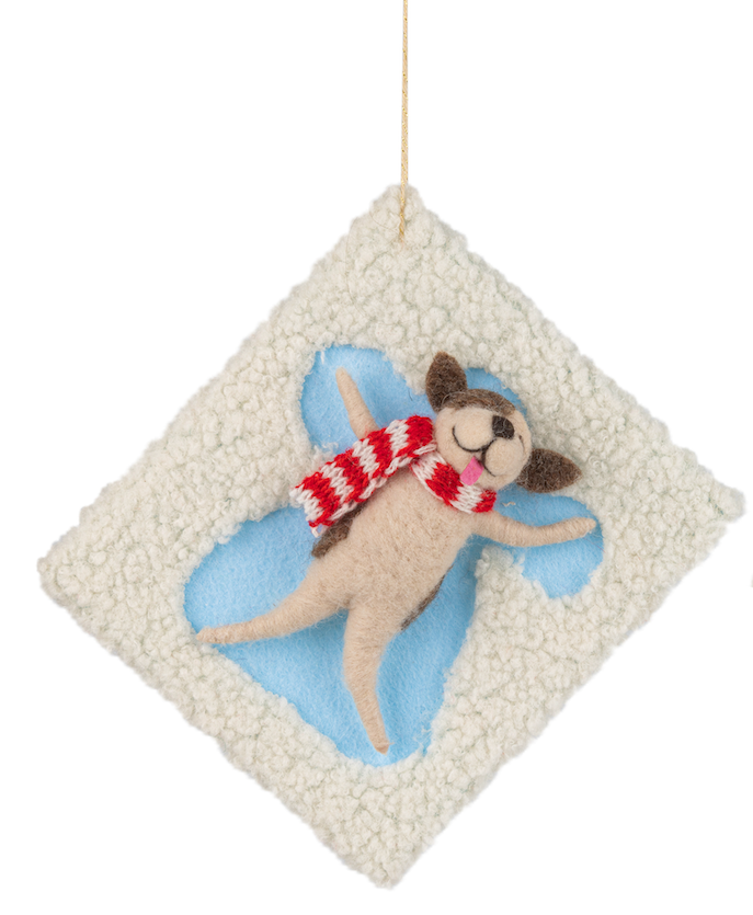 Felt ornament of dog making snow angel.