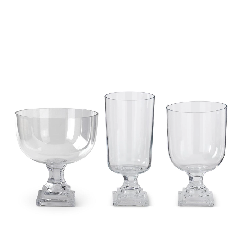 Set of 3 clear glass pedestal vases.