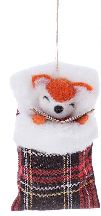 Felt fox ornament in sleeping bag with book.