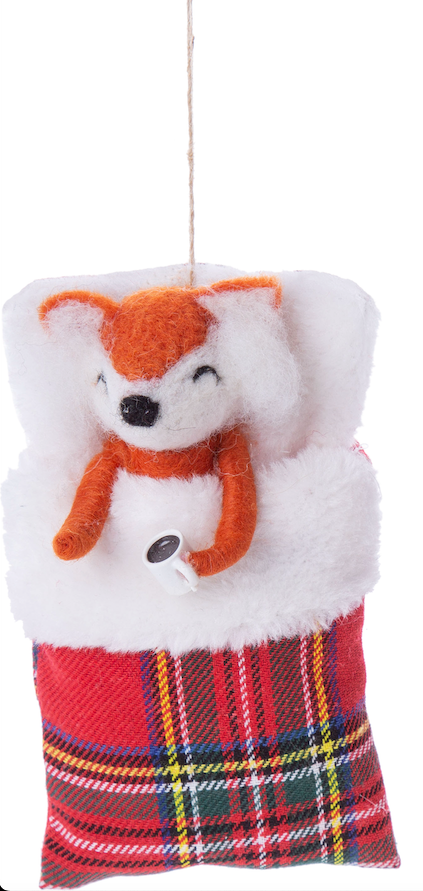 Felt fox ornament in sleeping bag with coffee.