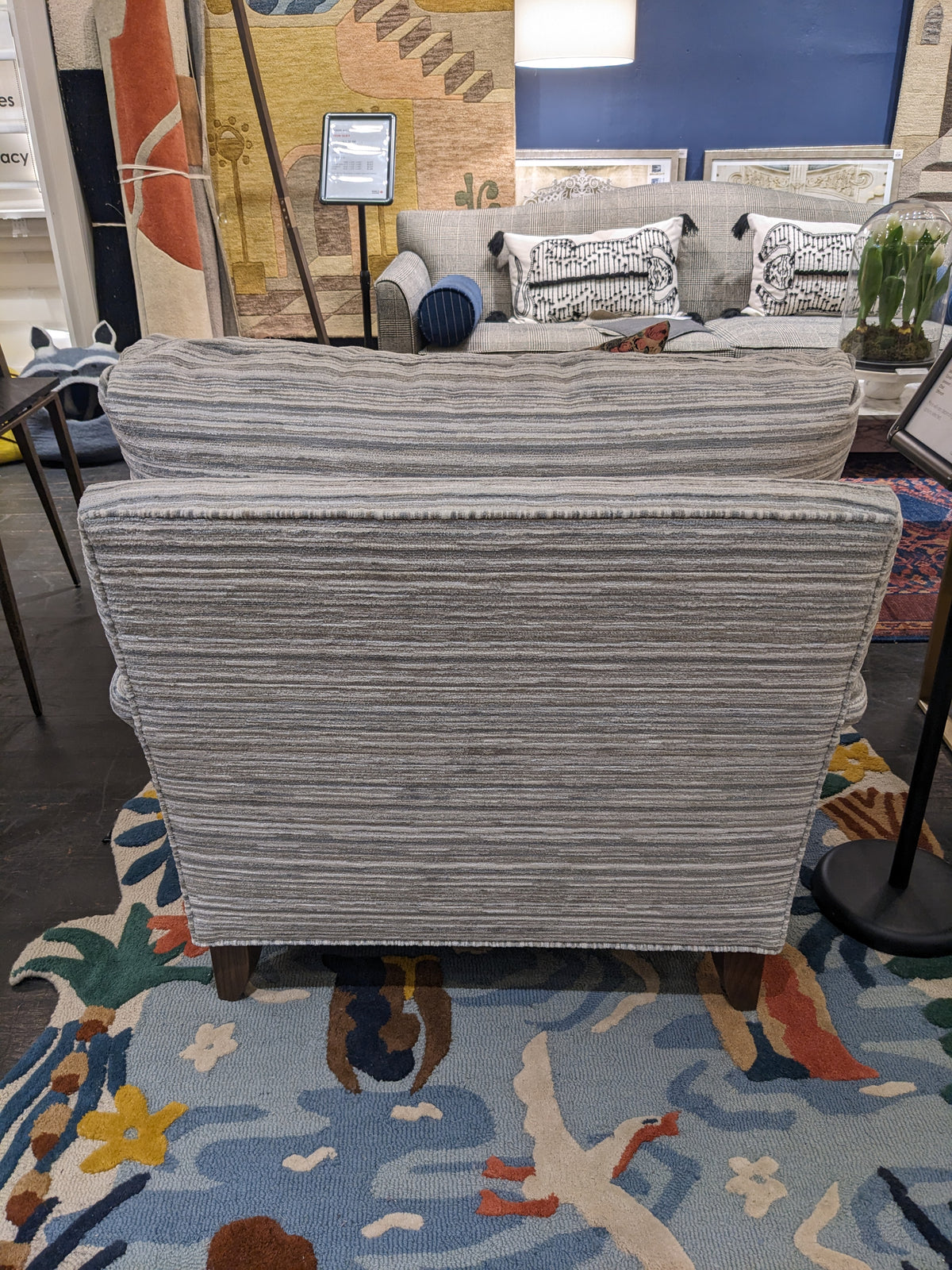 Back view of the Ingonish custom armchair in grey stripes.