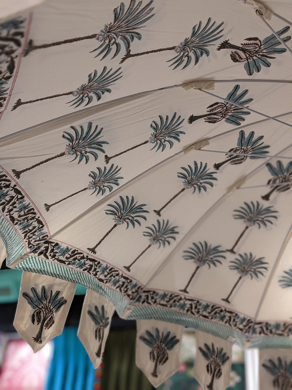 Hand block palm printed fabric parasol in blue.