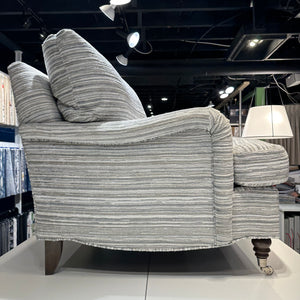 Side view of Ingonish armchair in grey stripes.