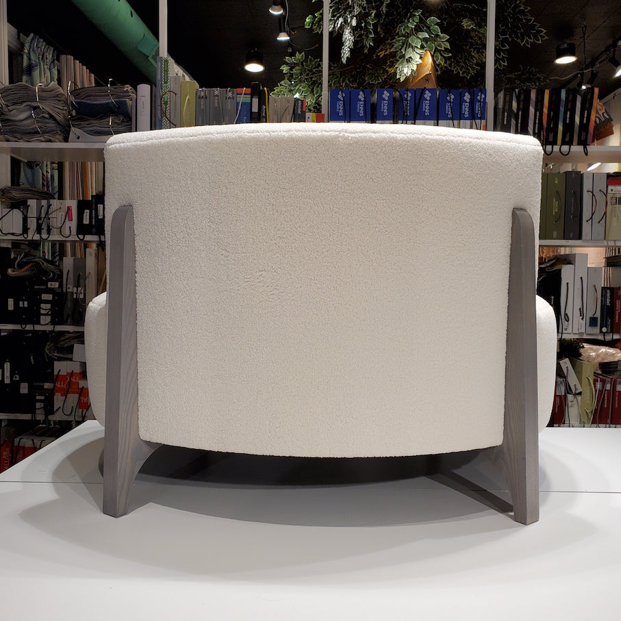 back of cream coloured curved sofa