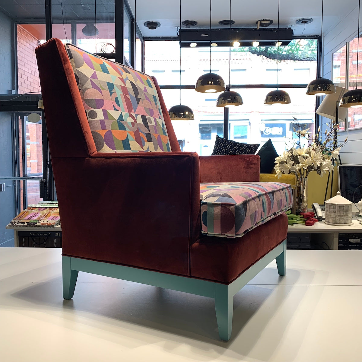 custom Wingback Chair upholstered in a beautiful Art Deco-style woven fabric and a rich burgundy velvet