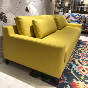 down filled yellow sofa